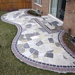 Flagstone patio bordered with Courtstone